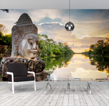 Image de Stone face Asura and sunset over moat Angkor Thom Cambodia